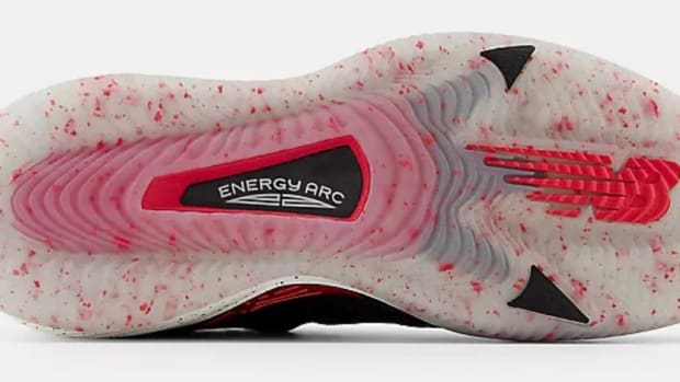 View of white and red New Balance shoe outsole.